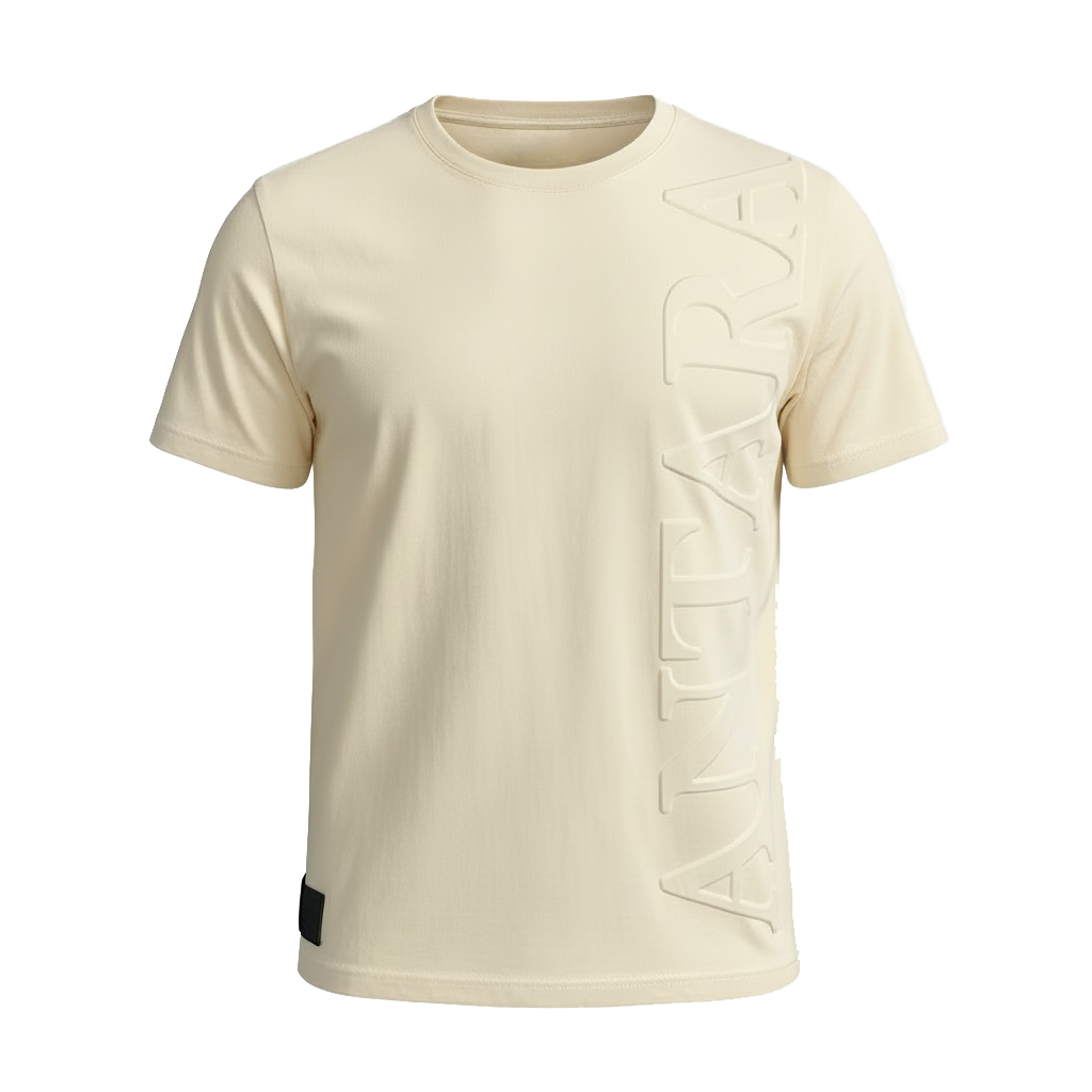 The Antara WHITEHAVEN ESSENTIAL T-SHIRT in classic beige features a round neck, vertical “ANTARA” embossing on the right side, and a black patch at the bottom left hem. Shown against a plain white background for a minimalist style.